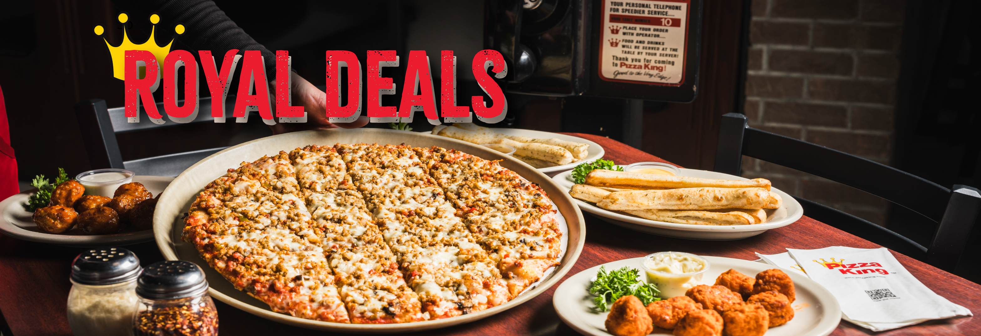 A famous pizza king pizza, breadstix, and wings